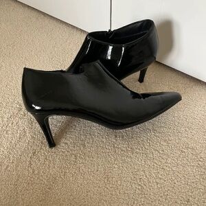 Sleek Black Patent Leather Heeled Boots